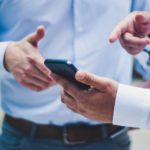 person holding black smartphone